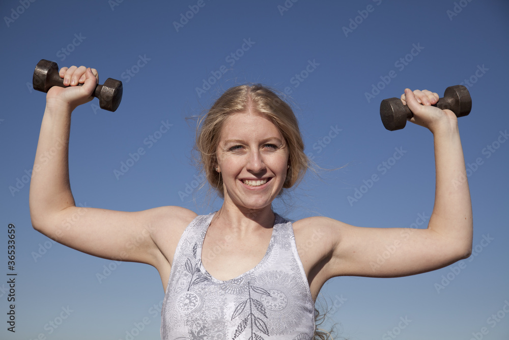 woman weights up blue sky woman weights up blue sky