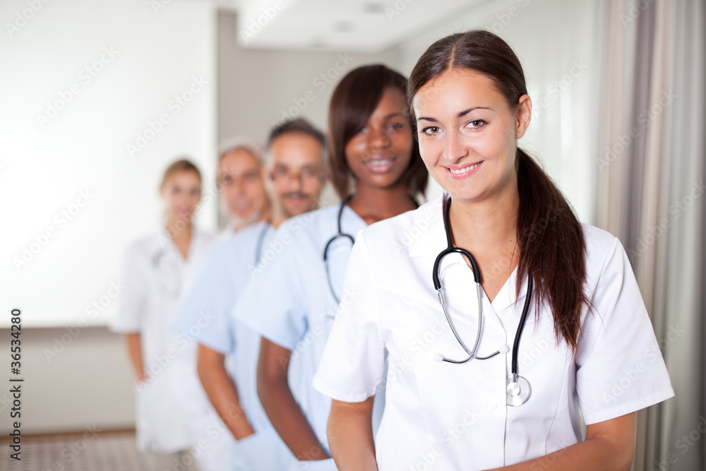 Young female doctor with group of colleagues Young female doctor with group of colleagues