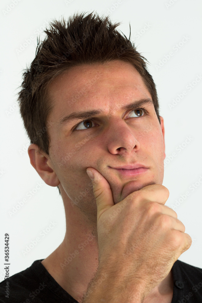 Fototapeta premium Man thinking with hand on face