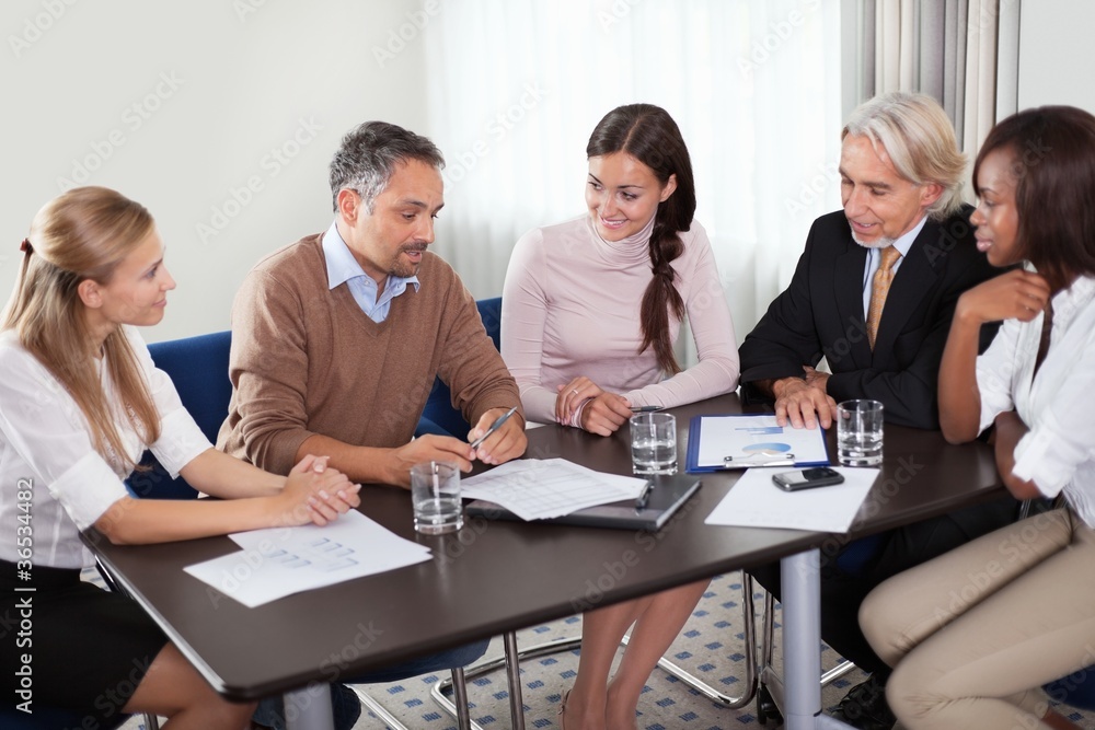 Fototapeta premium Creative workgroup reviewing new business plans