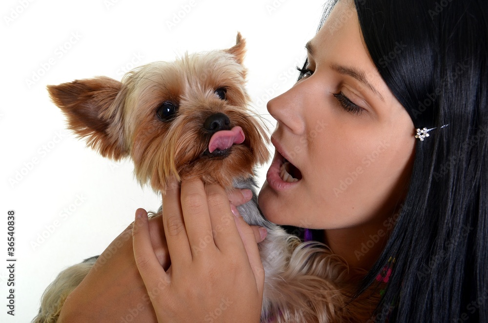 Pretty woman posing with puppy. Isolated on white Pretty woman posing with puppy. Isolated on white