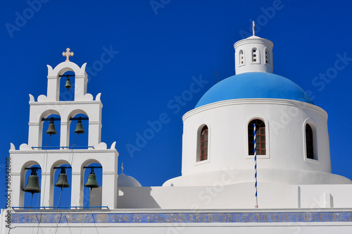Bell tower and blue dome in Oia