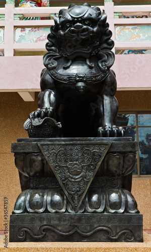 The statues metal lion at the Chinese temple. photo