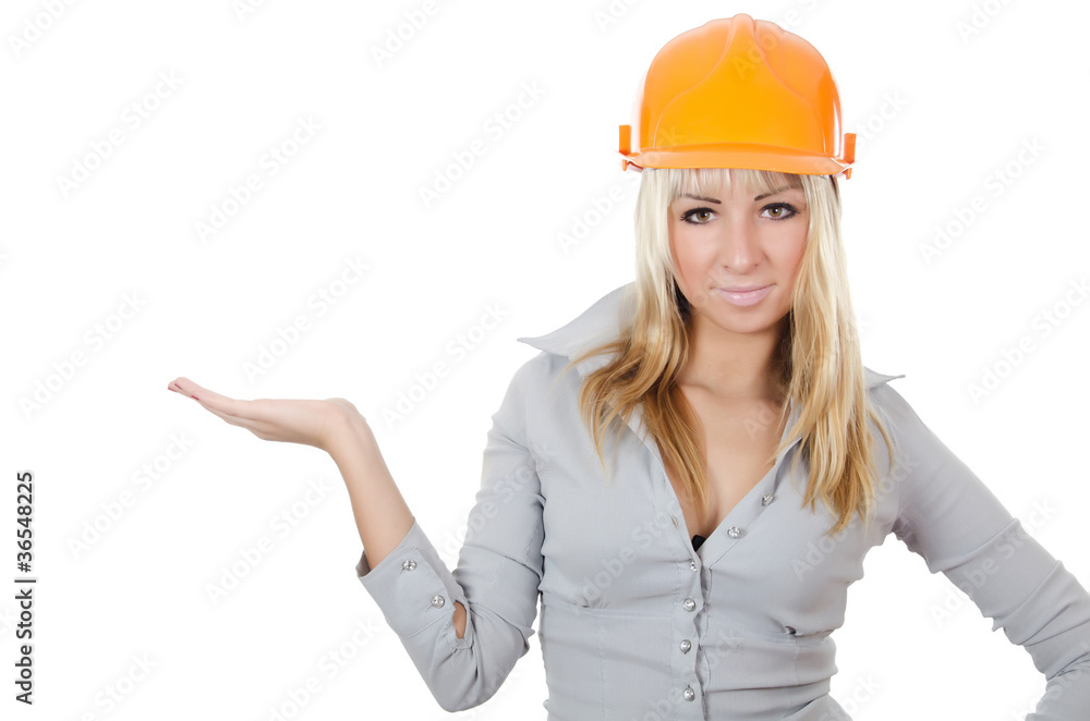 Beautiful girl in a building helmet