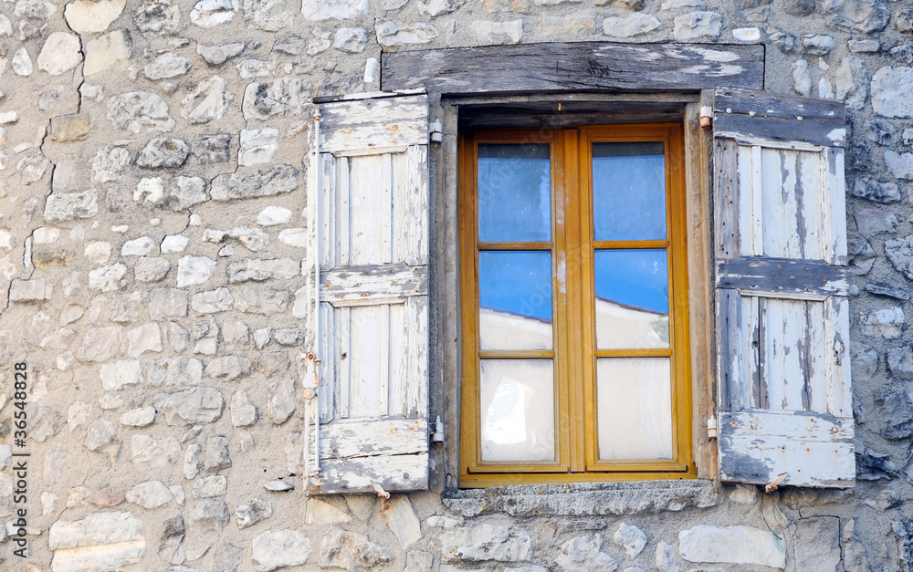 Window on old stone house in Sault, Provence in France Window on old stone house in Sault, Provence in France