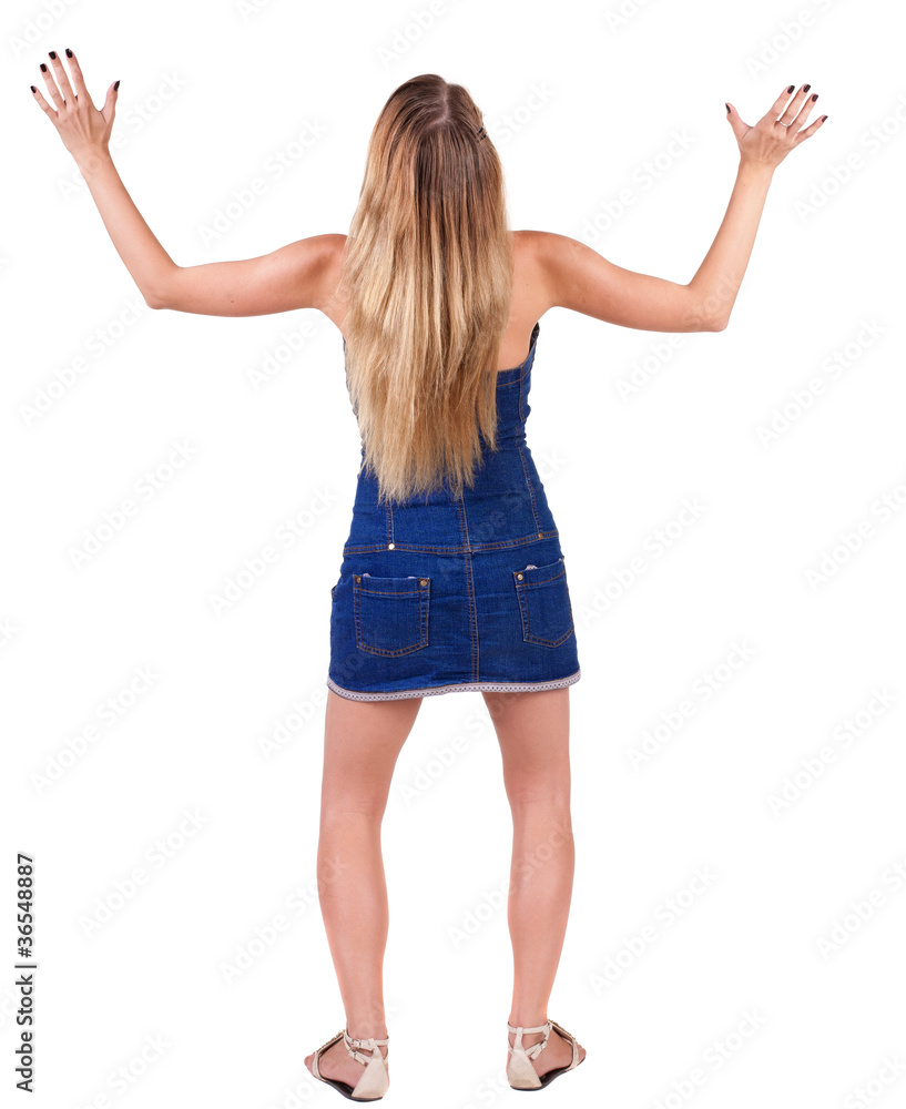 Back view of shocked and scared young beautiful woman. Back view of shocked and scared young beautiful woman.