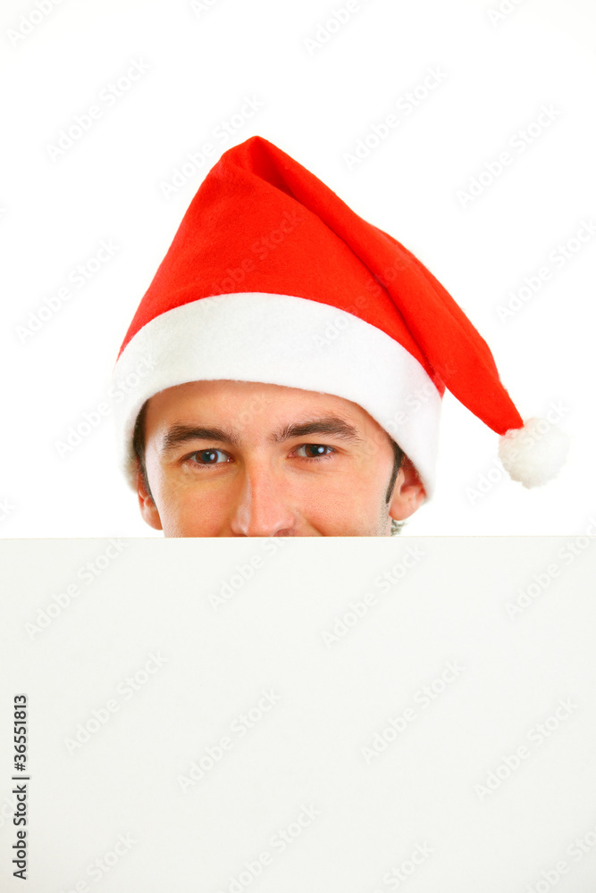 Hiding in front of blank billboard guy in Santa Hat Hiding in front of blank billboard guy in Santa Hat