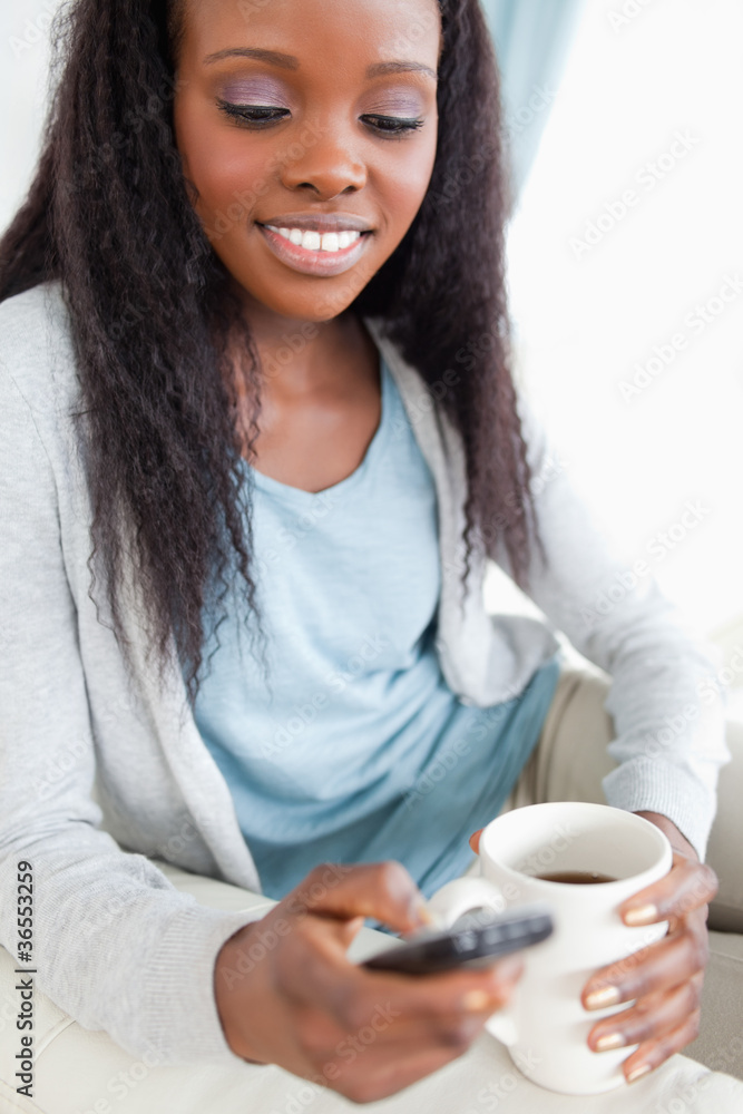 Close up of woman texting while having a caffee Close up of woman texting while having a caffee
