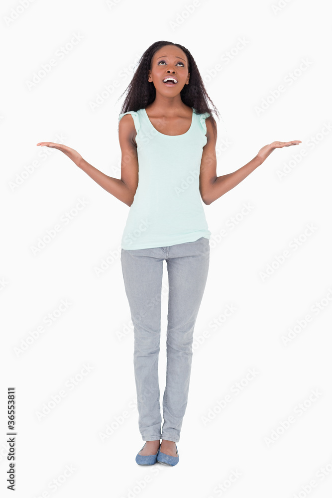 Desperate woman asking for help from above on white background Desperate woman asking for help from above on white background
