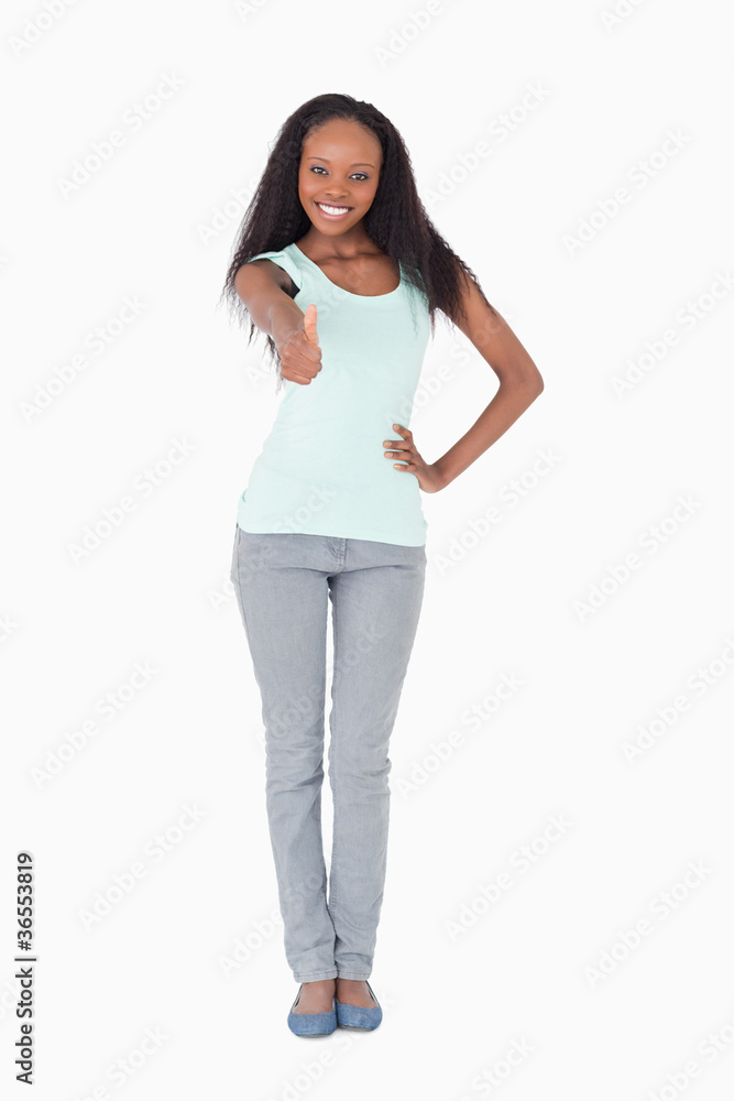 Woman giving thumb up on white background Woman giving thumb up on white background