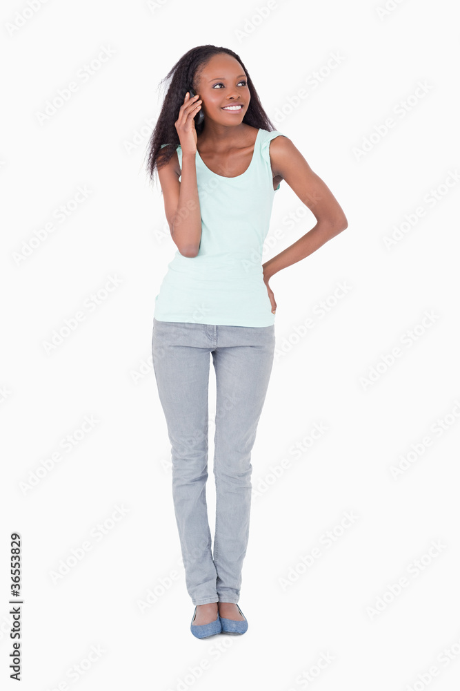 Woman talking on the phone on white background Woman talking on the phone on white background