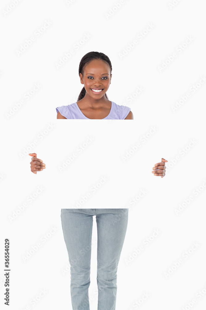 Happy woman presenting placeholder on white background Happy woman presenting placeholder on white background
