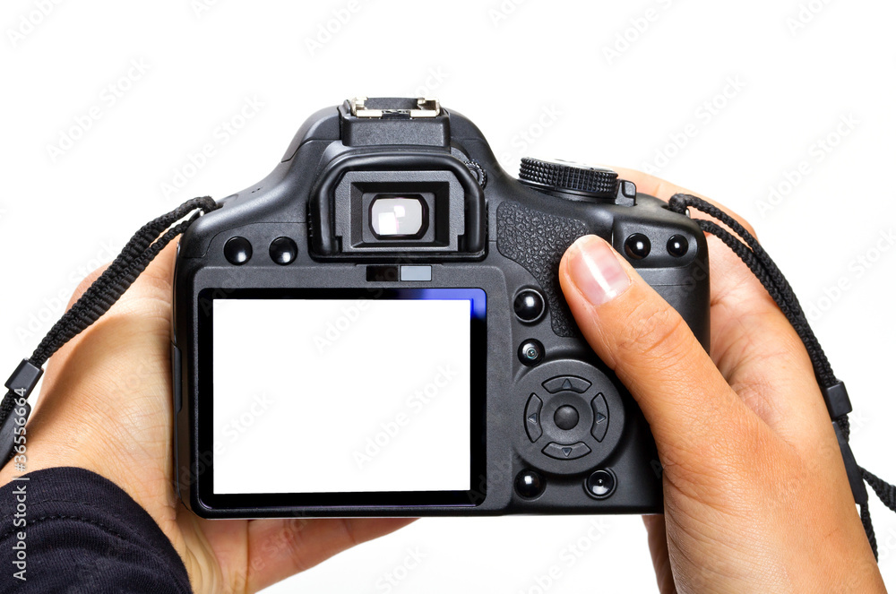 DSLR camera in female hands isolated on white DSLR camera in female hands isolated on white