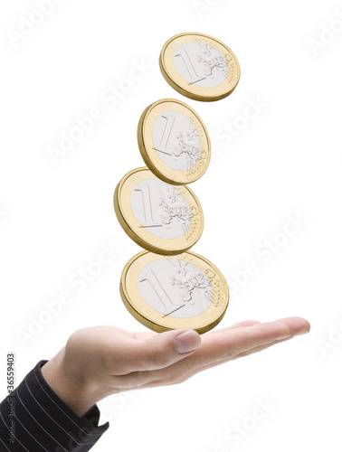 Geldmünzen mit Hand