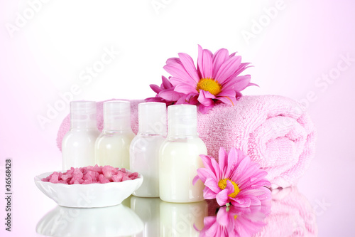 Hotel amenities kit on pink background