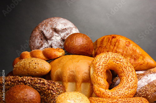 delicious bread on wooden table on gray background