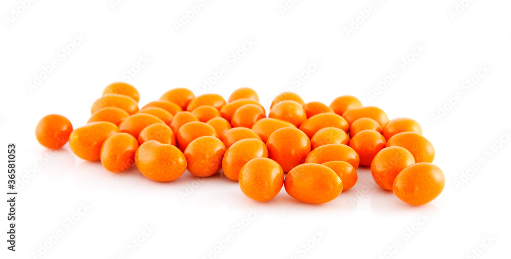 Orange frosted peanuts over white background
