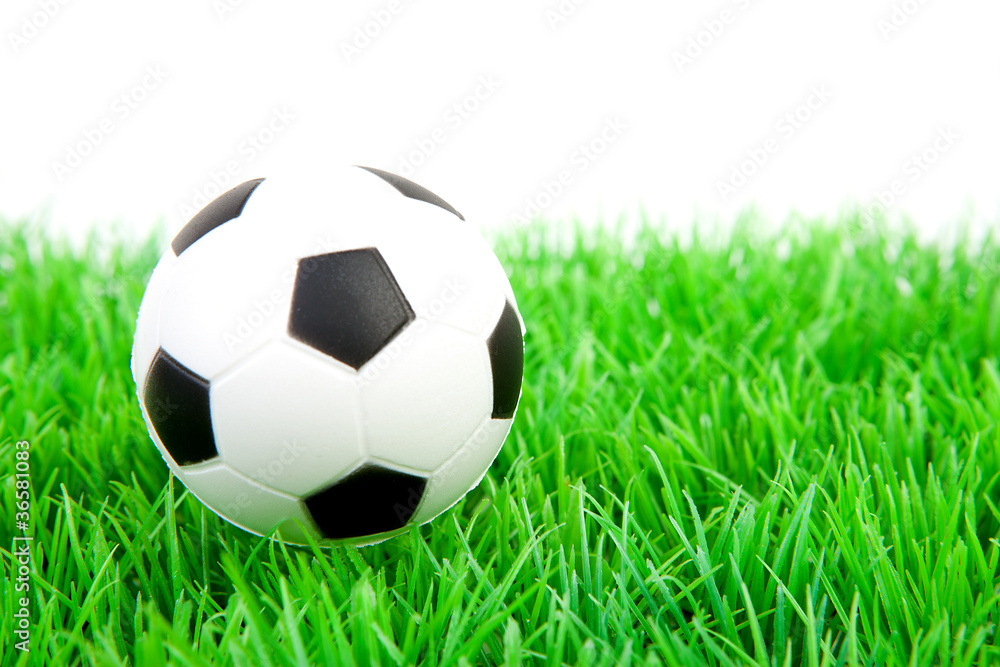 One soccer ball on plastic grass One soccer ball on plastic grass