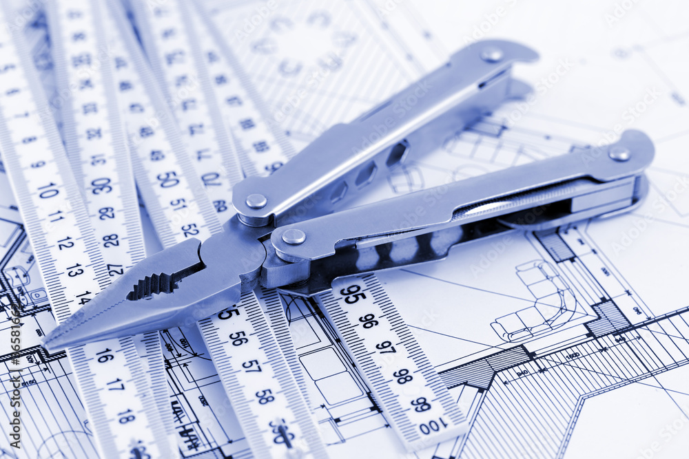 Fototapeta premium Pliers, metric folding ruler and architectural plan of the mode