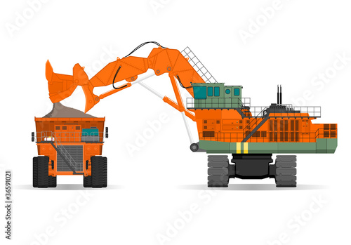 giant excavator and ridig dump truck in a surface mine