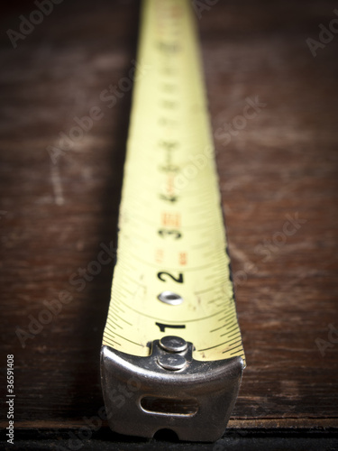 Old tape measure on an old table