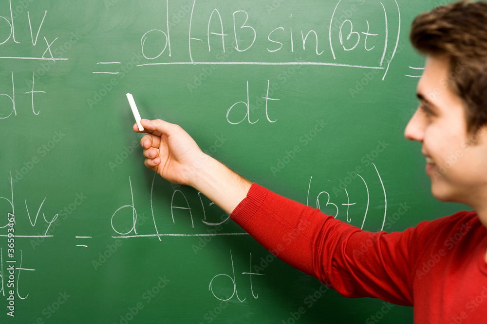 Student Doing Math on Chalkboard