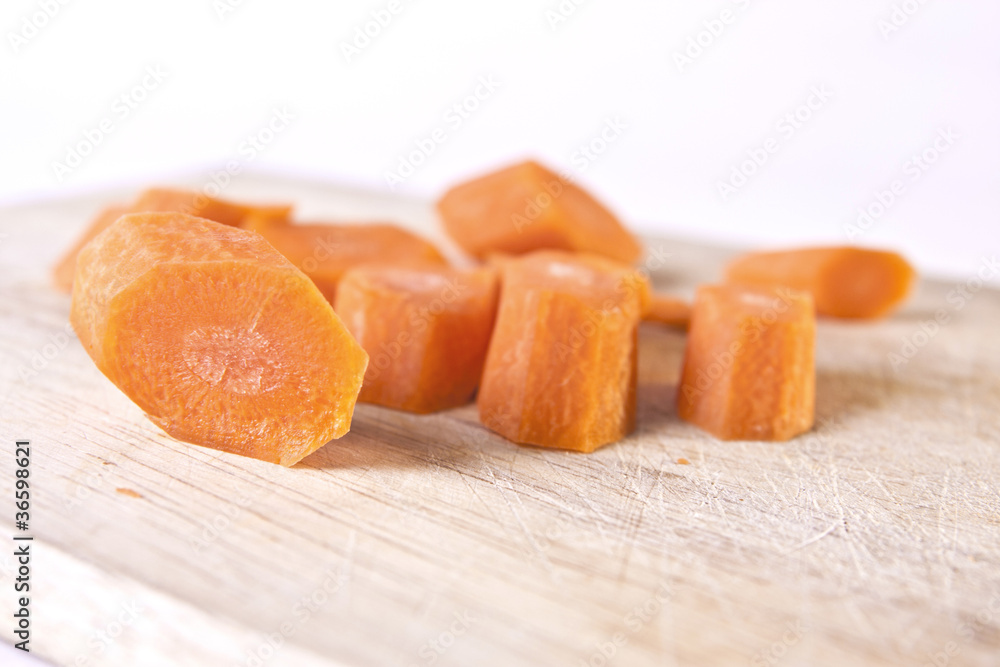 Carrot Sliced on a Wooden Chopping Board Carrot Sliced on a Wooden Chopping Board