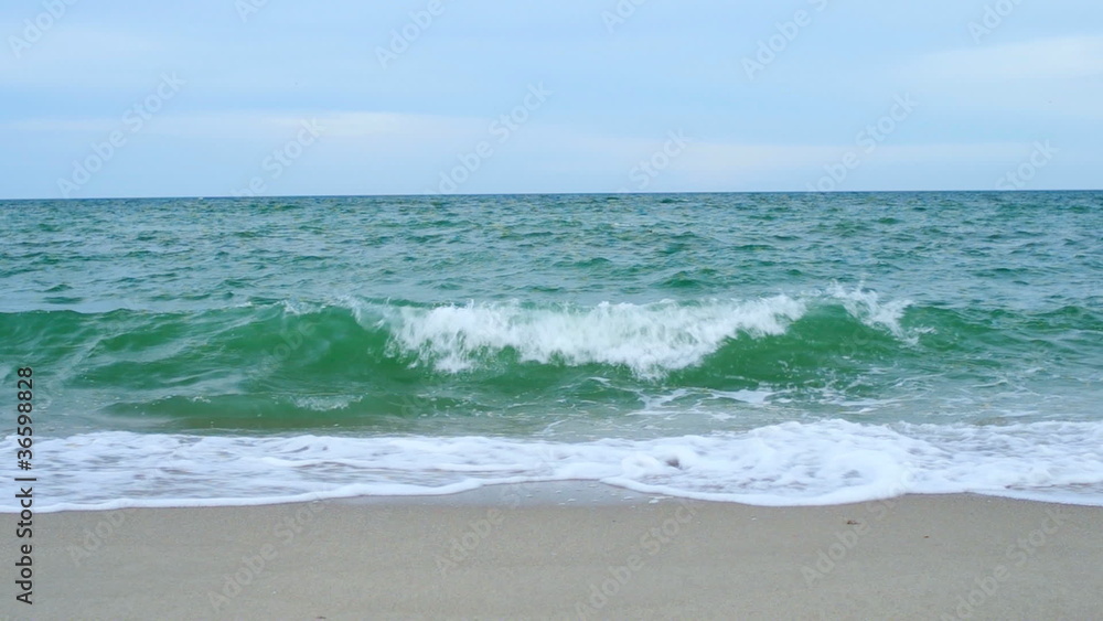 Azov sea, waves touching sandy beach Azov sea, waves touching sandy beach