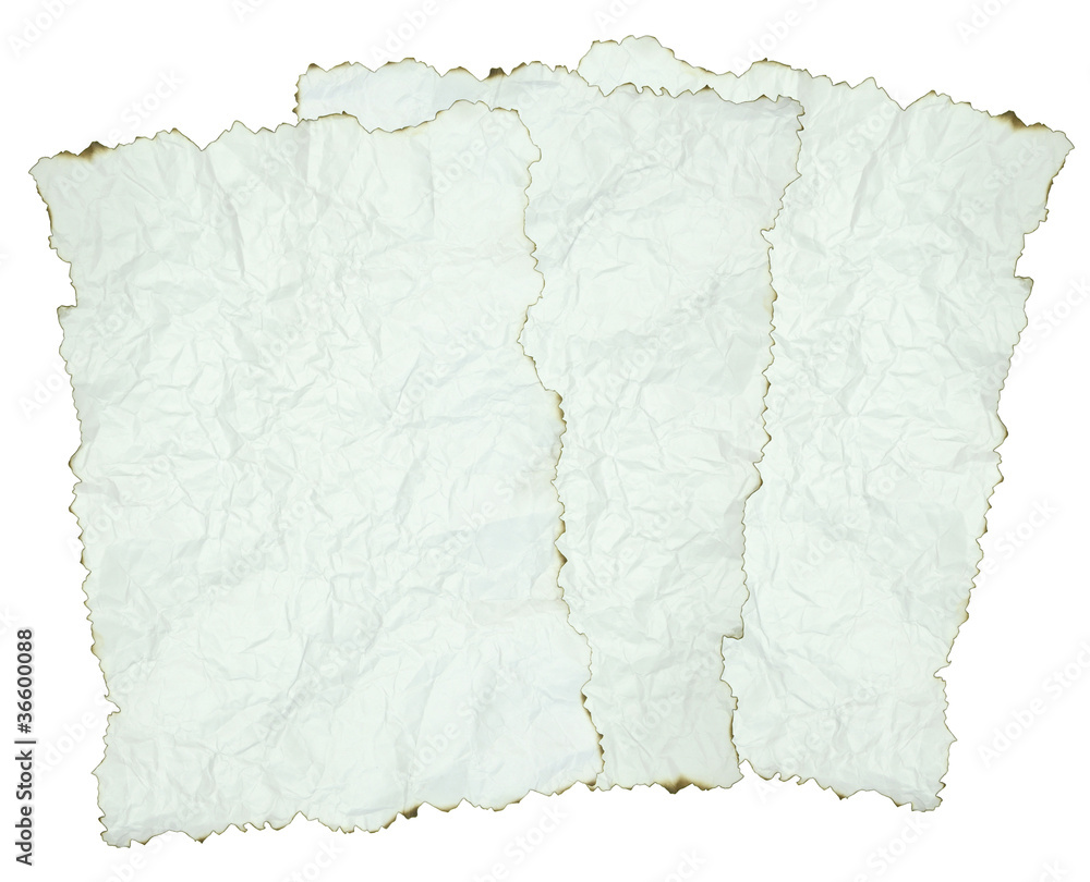 Obraz premium crumpled paper with burnt edges over white