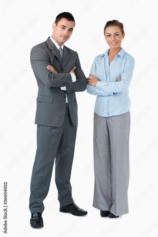 Business partner with arms folded against a white background Business partner with arms folded against a white background
