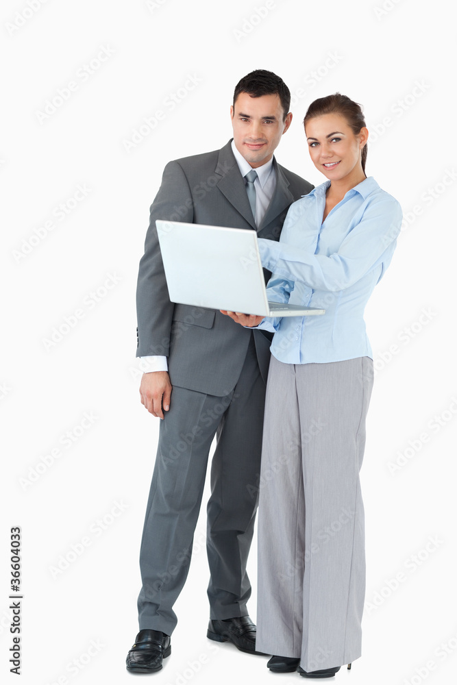 Business partner with laptop against a white background Business partner with laptop against a white background
