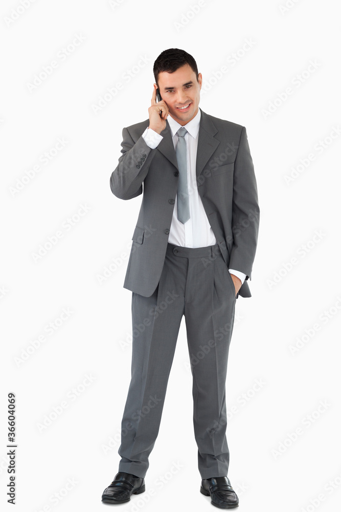 Businessman on the phone against a white background Businessman on the phone against a white background