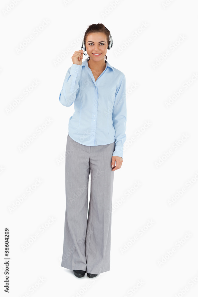 Businesswoman talking to caller through headset Businesswoman talking to caller through headset
