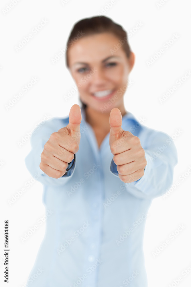 Smiling businesswoman giving her approval Smiling businesswoman giving her approval