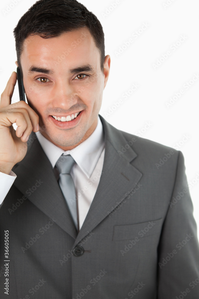 Close up of friendly smiling businessman on the phone Close up of friendly smiling businessman on the phone