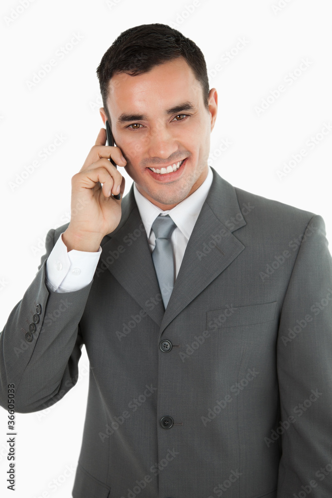Friendly smiling businessman on the phone Friendly smiling businessman on the phone