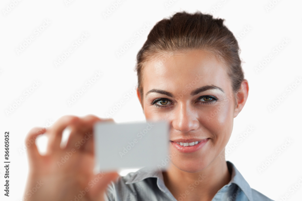 Close up of businesswoman showing her business card Close up of businesswoman showing her business card