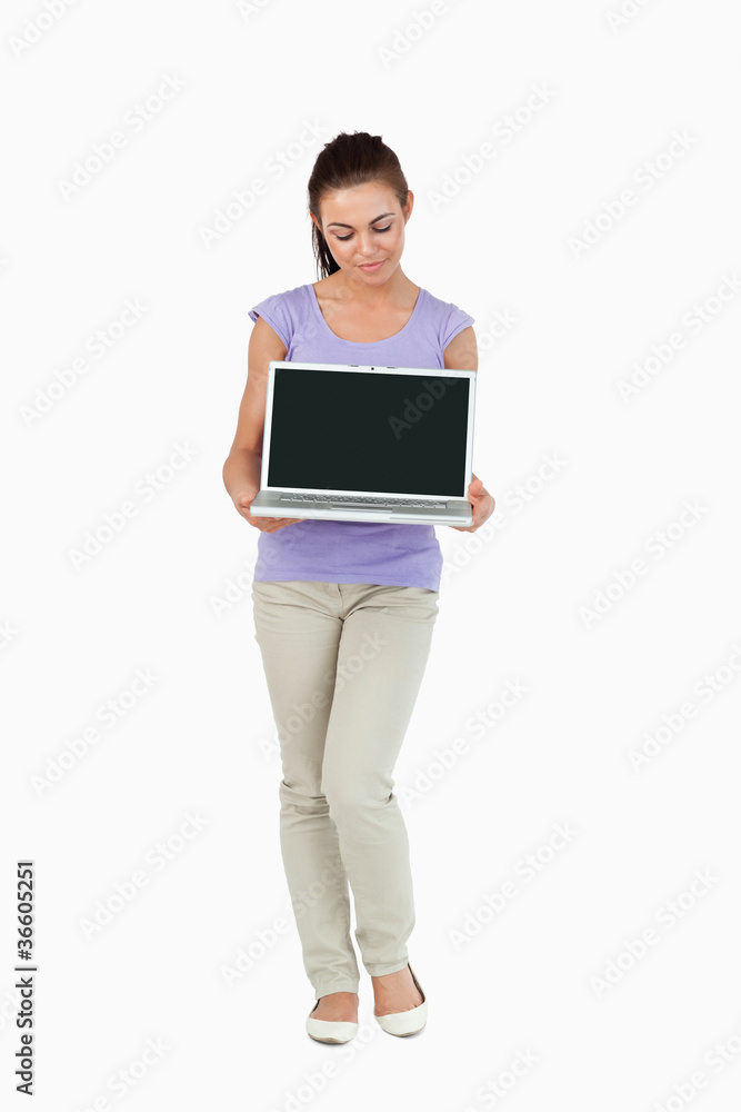 Young female holding her laptop