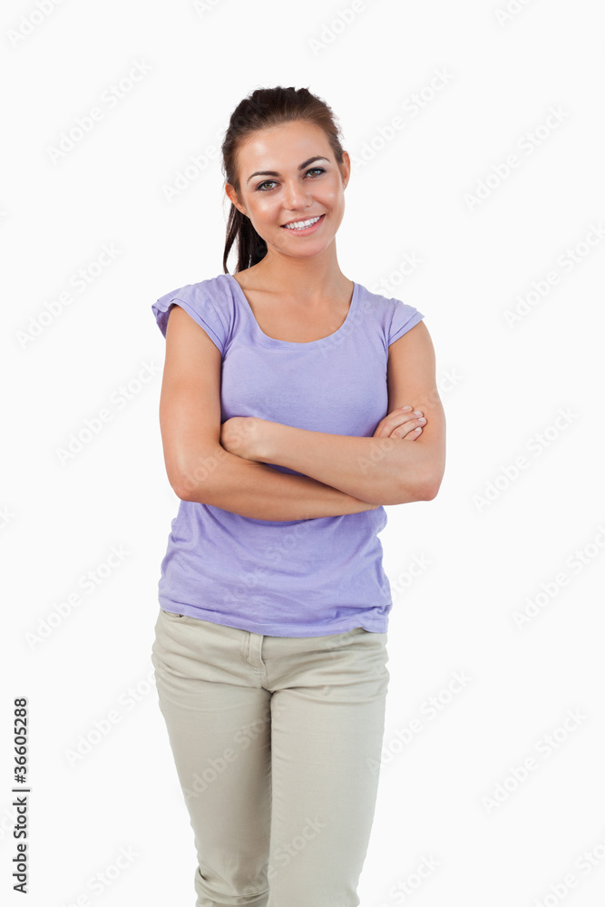 Smiling young female with arms folded Smiling young female with arms folded