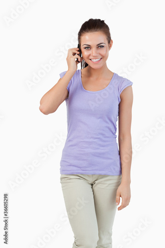 Smiling young female on the phone