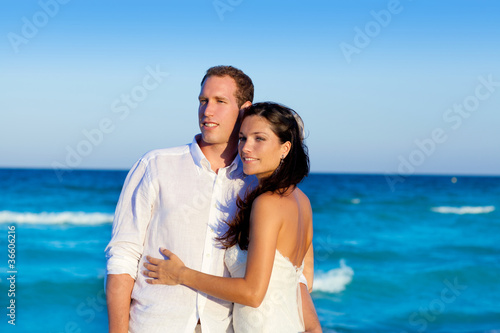 couple in love hug in blue sea vacation