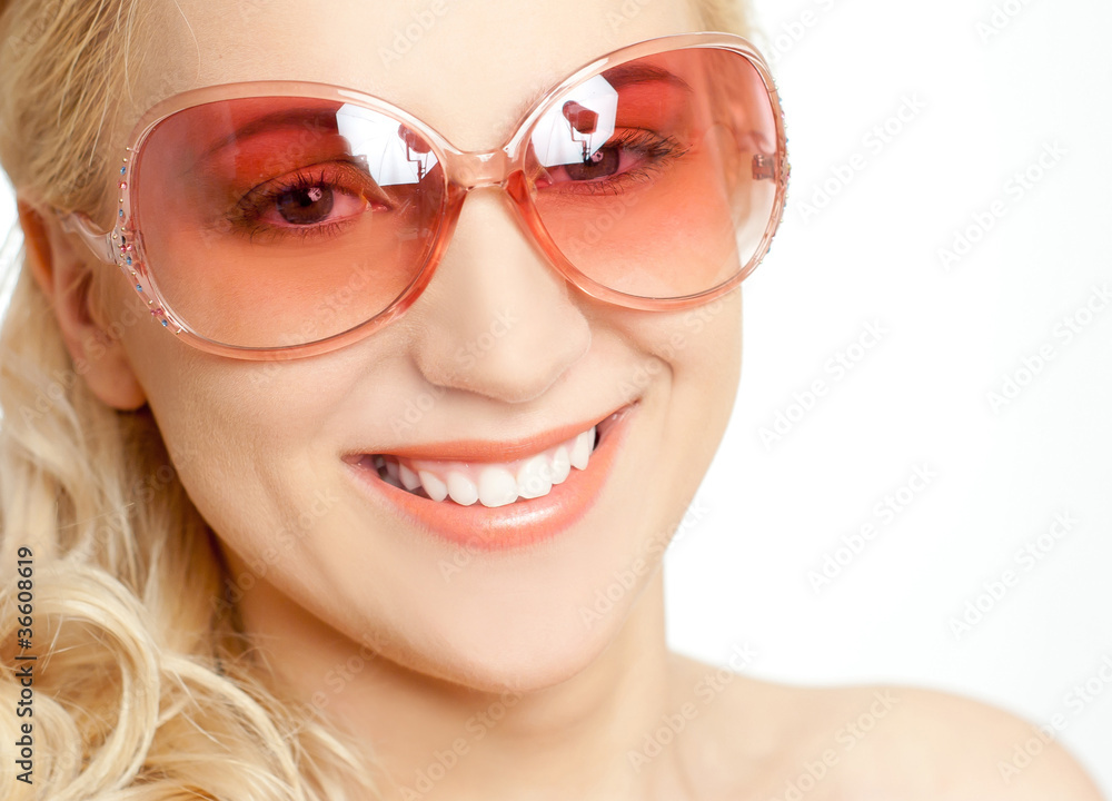 The woman in pink sun glasses