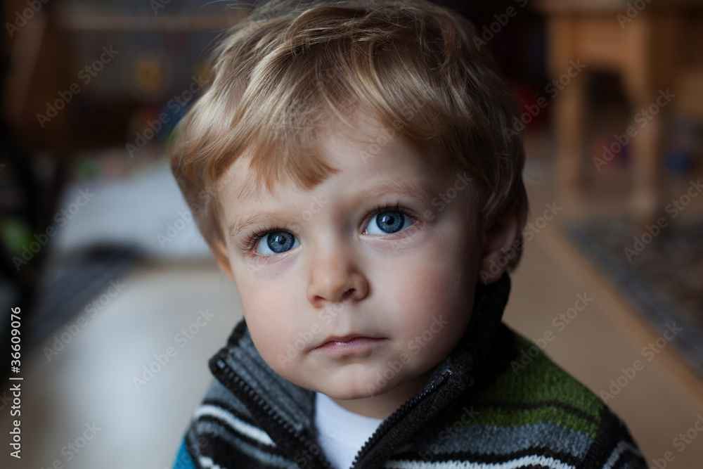 Baby boy with blue eyes looking at the camera Baby boy with blue eyes looking at the camera