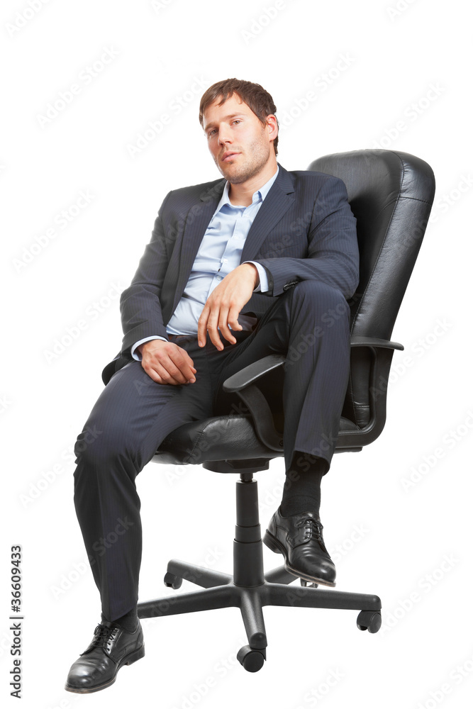 Young successful business man in executive chair Young successful business man in executive chair