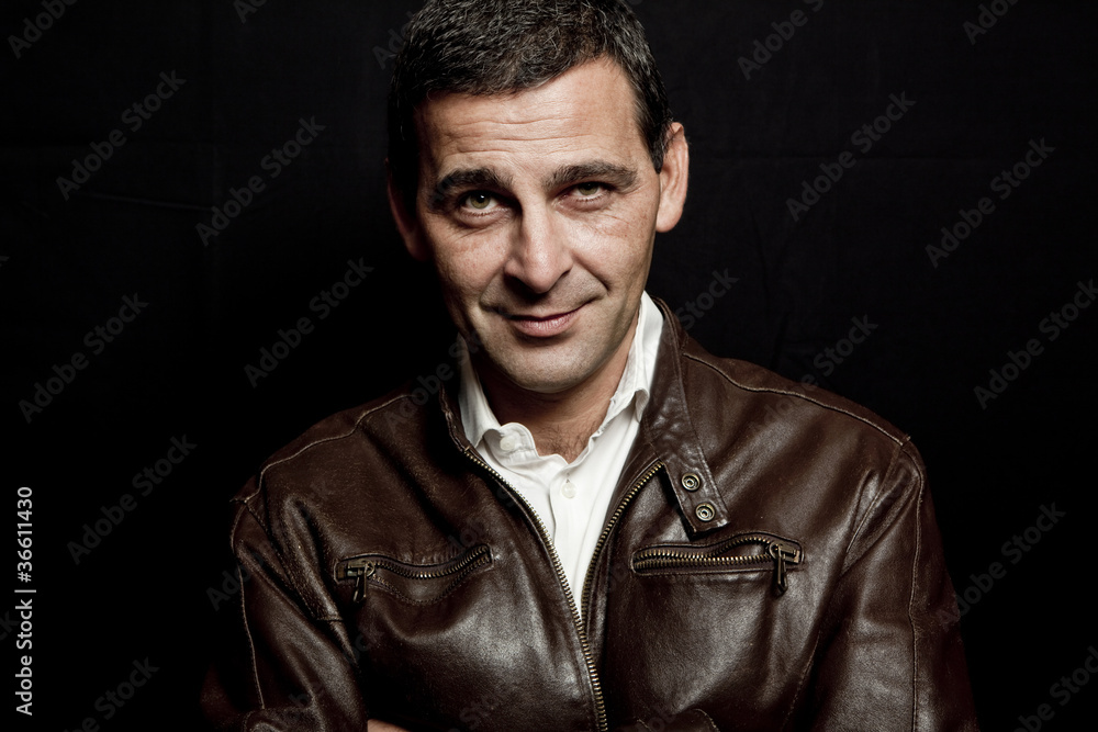 portrait of a cool mature man with leather jacket over black bac portrait of a cool mature man with leather jacket over black bac