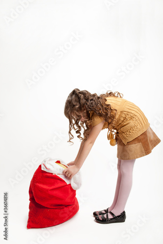 girl and a bag of gifts
