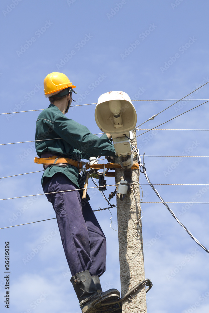Worker electrician repair lantern Worker electrician repair lantern