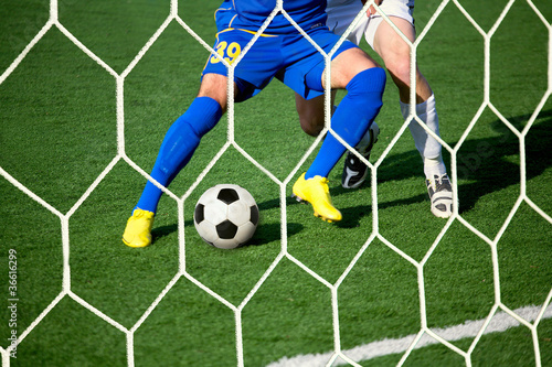 players at the gate with the ball.