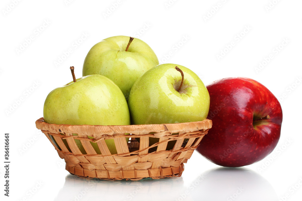 juicy green apples in basket and red apple isolated on white juicy green apples in basket and red apple isolated on white