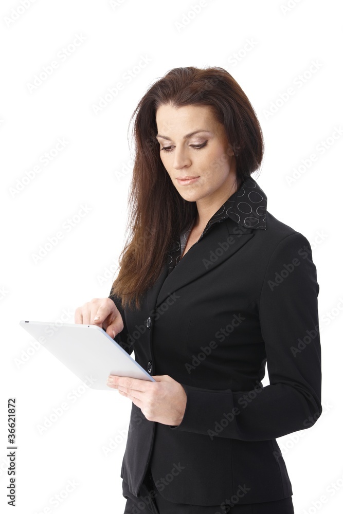 Businesswoman using tablet computer Businesswoman using tablet computer